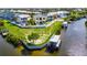 Waterfront home featuring a private dock, pool, and lush landscaping at 6522 Simone Shores Cir, Apollo Beach, FL 33572
