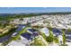 Aerial view highlighting the home's position in a waterfront neighborhood with canal access at 6522 Simone Shores Cir, Apollo Beach, FL 33572