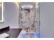 Modern bathroom features glass shower, granite countertop, toilet and recessed showerhead at 6522 Simone Shores Cir, Apollo Beach, FL 33572