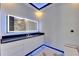 Modern bathroom features granite countertops, illuminated mirror and a toilet at 6522 Simone Shores Cir, Apollo Beach, FL 33572