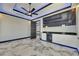 Bedroom featuring built in bar, modern lighting, a ceiling fan and marble flooring at 6522 Simone Shores Cir, Apollo Beach, FL 33572