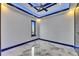 Minimalist bedroom with ceiling fan, LED accent lighting, and stylish marble floors at 6522 Simone Shores Cir, Apollo Beach, FL 33572