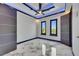 Bright bedroom features two large windows and minimalist design with marble floors at 6522 Simone Shores Cir, Apollo Beach, FL 33572