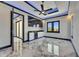 Bedroom featuring built in bar, modern lighting, a ceiling fan and marble flooring at 6522 Simone Shores Cir, Apollo Beach, FL 33572