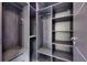 Spacious walk-in closet featuring custom shelving and drawers for optimal organization at 6522 Simone Shores Cir, Apollo Beach, FL 33572