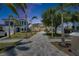 Beautiful home with lush lawn, palm trees, and a paved driveway at 6522 Simone Shores Cir, Apollo Beach, FL 33572