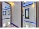 Hallway has detailed ceilings and modern LED lighting, creating an inviting atmosphere at 6522 Simone Shores Cir, Apollo Beach, FL 33572