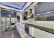 Modern kitchen with island, stainless steel appliances, and unique backsplash at 6522 Simone Shores Cir, Apollo Beach, FL 33572