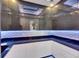 Modern kitchen with unique lighting and sleek, high end finishes at 6522 Simone Shores Cir, Apollo Beach, FL 33572
