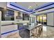 Spacious kitchen featuring a large island, stainless steel appliances, and access to the outdoor patio at 6522 Simone Shores Cir, Apollo Beach, FL 33572