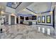 Contemporary living room with marble flooring, modern light fixtures, and views of the kitchen at 6522 Simone Shores Cir, Apollo Beach, FL 33572