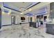 Contemporary living room with marble flooring, modern light fixtures, and fireplace at 6522 Simone Shores Cir, Apollo Beach, FL 33572