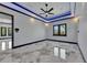 Spacious main bedroom with tray ceiling and marble floors at 6522 Simone Shores Cir, Apollo Beach, FL 33572