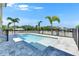 A swimming pool features an attached spa and an interlock brick patio at 6522 Simone Shores Cir, Apollo Beach, FL 33572