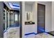 Walk-in closet and vanity illuminated with LED lighting at 6522 Simone Shores Cir, Apollo Beach, FL 33572