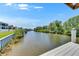 A scenic view of the canal from the wooden dock at 6522 Simone Shores Cir, Apollo Beach, FL 33572