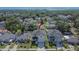 A neighborhood featuring a home with a dark roof, green lawns, and a well-manicured street view at 7203 1/2 S West Shore Blvd, Tampa, FL 33616