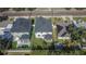 An aerial view showing the home with a pool, patio, and a fenced yard at 7203 1/2 S West Shore Blvd, Tampa, FL 33616