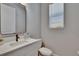 Modern half-bathroom features a sleek sink, faucet, and ample natural light at 7203 1/2 S West Shore Blvd, Tampa, FL 33616