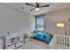 Well-lit bedroom with carpet, a ceiling fan and window showcasing a bright, comfortable space at 7203 1/2 S West Shore Blvd, Tampa, FL 33616