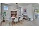 Elegant dining room with stylish light fixture, wood floors, and modern decor at 7203 1/2 S West Shore Blvd, Tampa, FL 33616