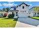 Charming modern farmhouse-style home with black trim, white siding, and a well-manicured lawn at 7203 1/2 S West Shore Blvd, Tampa, FL 33616