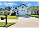 Attractive two-story home with a neat front yard and mailbox, complemented by a long driveway at 7203 1/2 S West Shore Blvd, Tampa, FL 33616