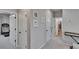 Hallway with plush carpeting leading to various rooms at 7203 1/2 S West Shore Blvd, Tampa, FL 33616