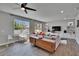 Bright living room with large windows, recessed lighting, ceiling fan, and an open floor plan at 7203 1/2 S West Shore Blvd, Tampa, FL 33616