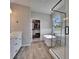 Naturally lit main bathroom features walk in shower, soaker tub, and walk in closet at 7203 1/2 S West Shore Blvd, Tampa, FL 33616