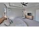 Lovely main bedroom features tray ceilings, recessed lighting, and a tasteful color palette at 7203 1/2 S West Shore Blvd, Tampa, FL 33616