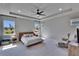 Spacious main bedroom features tray ceiling, recessed lighting and generous natural light at 7203 1/2 S West Shore Blvd, Tampa, FL 33616