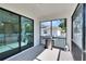 Covered outdoor space equipped with a grill and sliding doors, ideal for enjoying the outdoors at 7203 1/2 S West Shore Blvd, Tampa, FL 33616