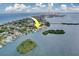 An aerial view showcases the home's prime waterfront location at 803 Harbor Dr, Belleair Beach, FL 33786