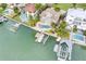 Waterfront home with a private boat dock, lift, and an inviting backyard pool at 803 Harbor Dr, Belleair Beach, FL 33786