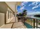 Long balcony overlooking the pool and water with a view of the surrounding area at 803 Harbor Dr, Belleair Beach, FL 33786