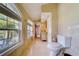 Bathroom featuring marble floors, toilet, and a vanity with oval mirror and vanity lights at 803 Harbor Dr, Belleair Beach, FL 33786