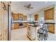 Spacious kitchen boasts an island with seating, stainless appliances, and ample cabinet space at 803 Harbor Dr, Belleair Beach, FL 33786