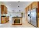 Gourmet kitchen featuring custom cabinets, granite countertops, and stainless steel appliances at 803 Harbor Dr, Belleair Beach, FL 33786