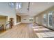 Spacious living room with french doors, built in shelves and hardwood floors at 803 Harbor Dr, Belleair Beach, FL 33786