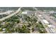 A detailed view of the property within a residential neighborhood, near stores and close to a major thoroughfare at 8517 N Branch Ave, Tampa, FL 33604