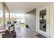 Covered back porch with grill and views of fenced backyard at 8517 N Branch Ave, Tampa, FL 33604