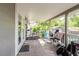 Spacious covered back porch with exercise equipment and great backyard views at 8517 N Branch Ave, Tampa, FL 33604