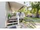 Lovely backyard with covered patio and mature trees at 8517 N Branch Ave, Tampa, FL 33604