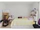 Spacious bedroom with white walls, window and trundle bed with built in bookshelf at 8517 N Branch Ave, Tampa, FL 33604