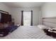 Comfortable bedroom with window, dresser, and TV, providing ample space and natural light at 8517 N Branch Ave, Tampa, FL 33604