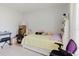 Spacious bedroom with white walls, window and trundle bed with built in bookshelf at 8517 N Branch Ave, Tampa, FL 33604