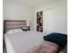 Bright bedroom featuring a sliding door closet with ample space at 8517 N Branch Ave, Tampa, FL 33604