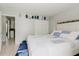 Bedroom features a bed with a white headboard, a closet, and neutral colored walls at 8517 N Branch Ave, Tampa, FL 33604