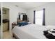Bedroom featuring a window with natural light, TV on dresser and tile flooring at 8517 N Branch Ave, Tampa, FL 33604